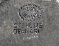 A Danish Silver Flatware Service, Georg Jensen Silversmithy, Copenhagen, 20th Century, Cactus pattern, comprising: 12 serrated blade di