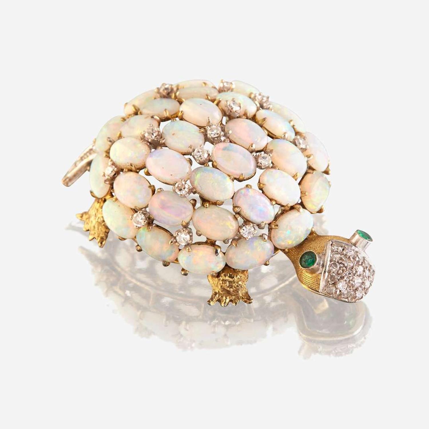 An opal, diamond, emerald, and fourteen karat gold brooch