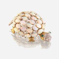 An opal, diamond, emerald, and fourteen karat gold brooch