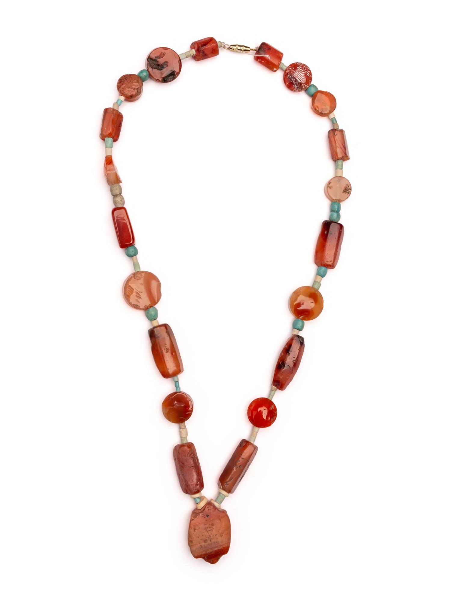 An Egyptian Carnelian and Faience Necklace