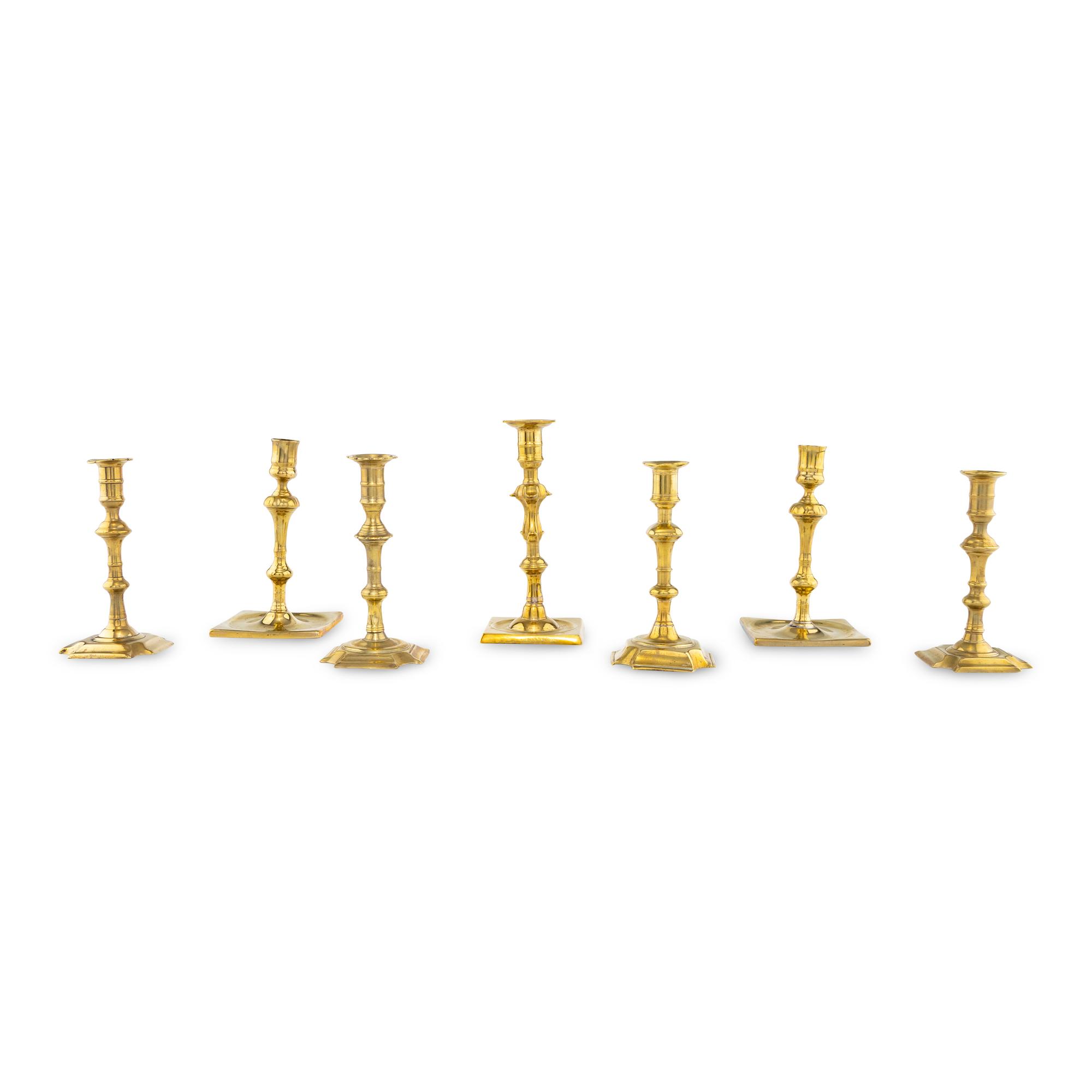 A Group of Seven Brass Candlesticks
