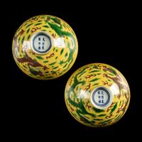 A Pair of Chinese Yellow-Ground Green and Aubergine-Enameled Porcelain 'Dragon' Bowls — 黃地素三彩龍紋碗一對