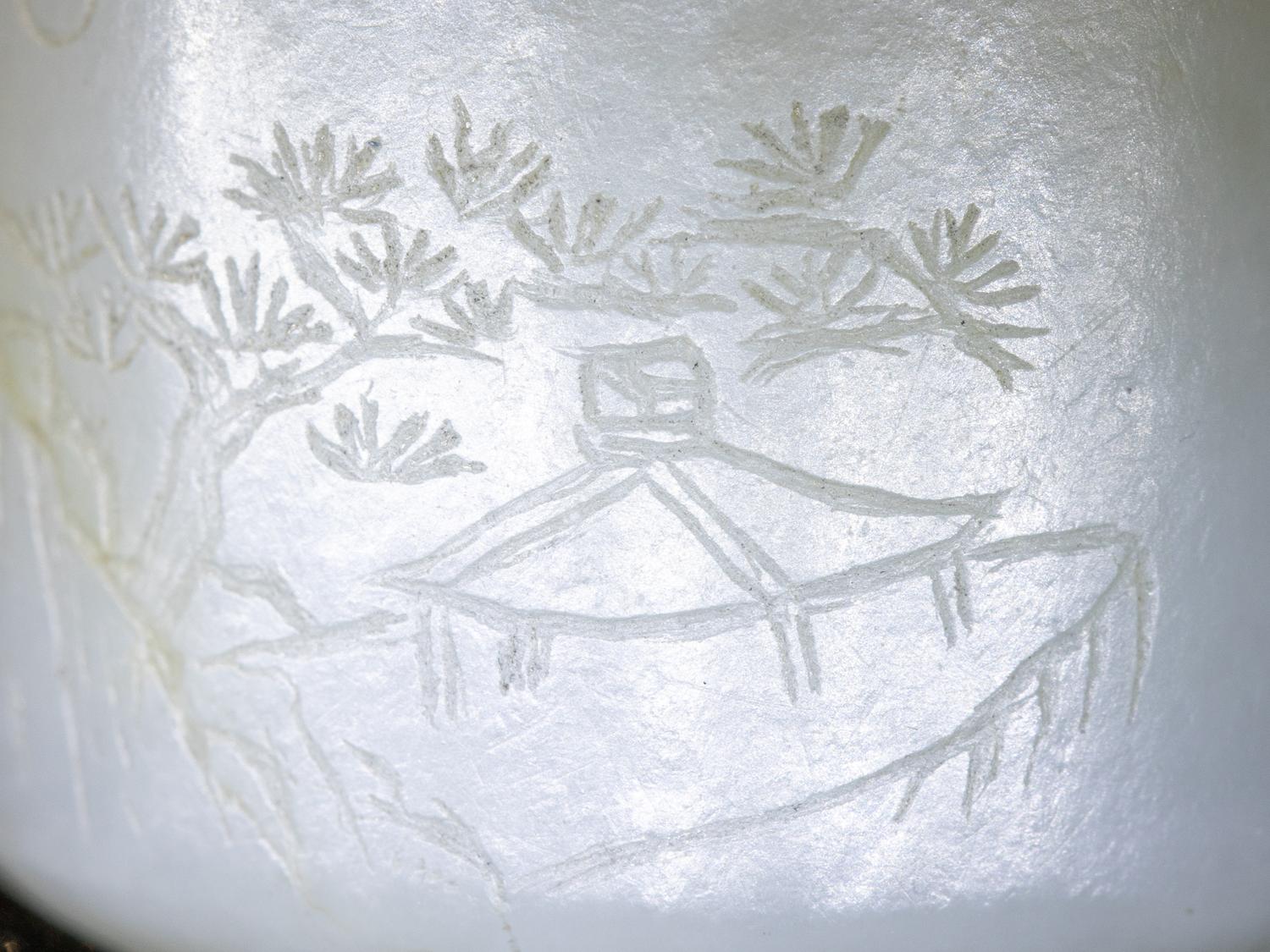 An Incised White Jade 'Landscape' Archer's Ring