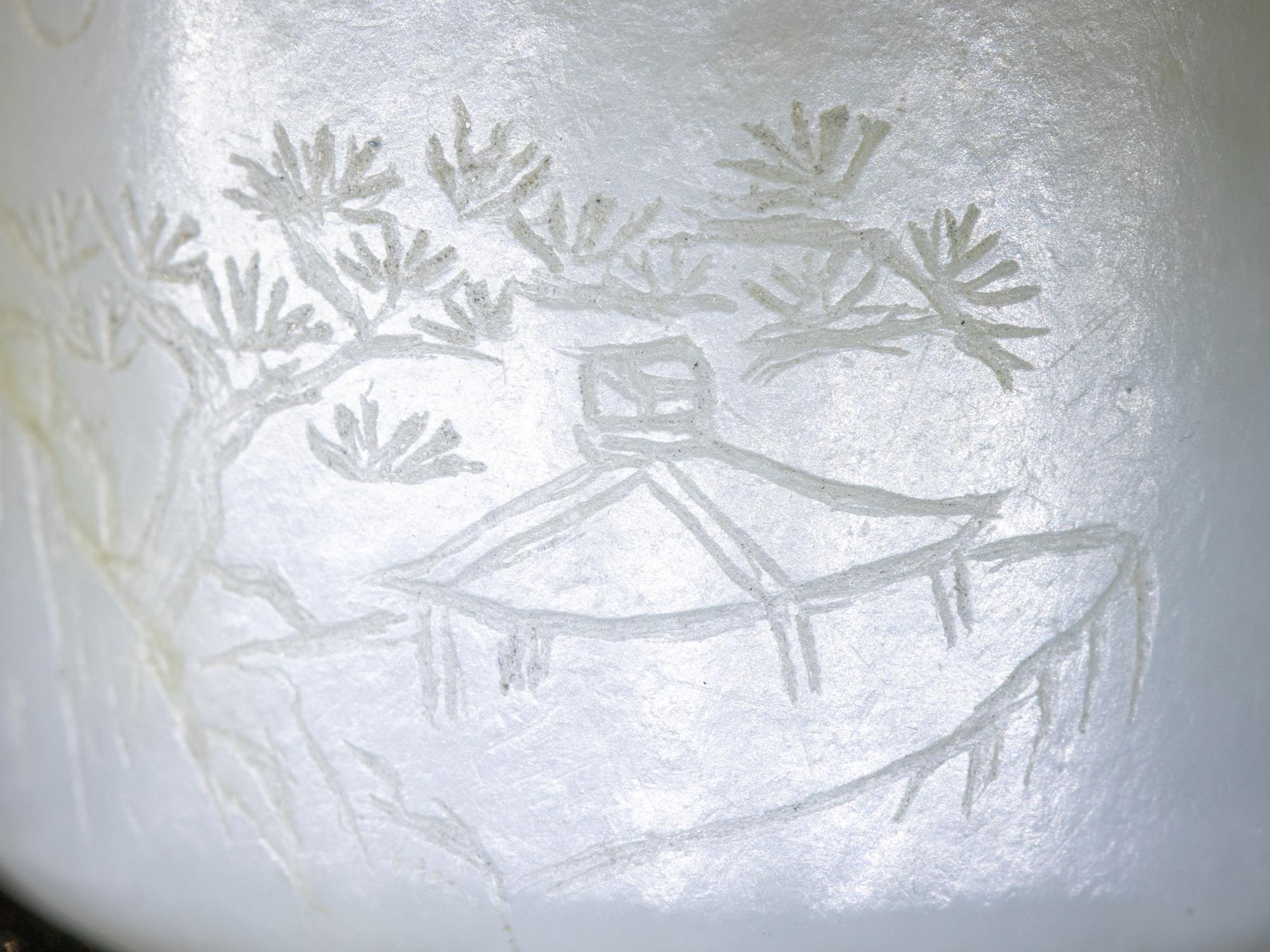 An Incised White Jade 'Landscape' Archer's Ring