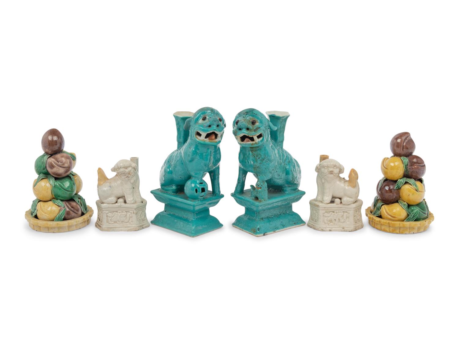 Two Pairs of Chinese Monochrome Glazed Porcelain Figures of Fu Lions and a Pair of Sancai Glazed Porcelain Models of Fruit