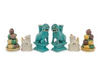 Two Pairs of Chinese Monochrome Glazed Porcelain Figures of Fu Lions and a Pair of Sancai Glazed Porcelain Models of Fruit