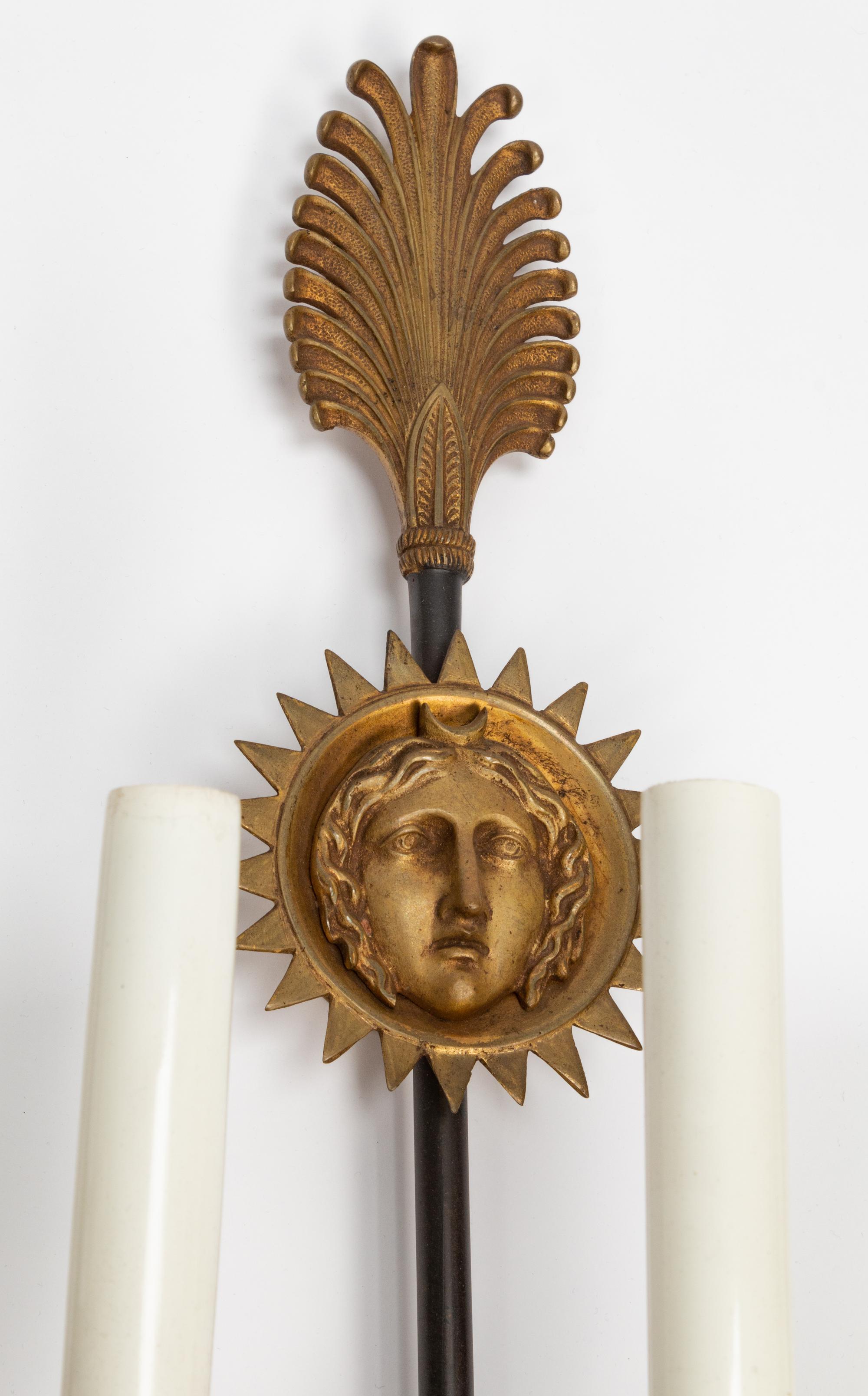 A Pair of Empire Style Gilt and Patinated Bronze Three-Light Sconces