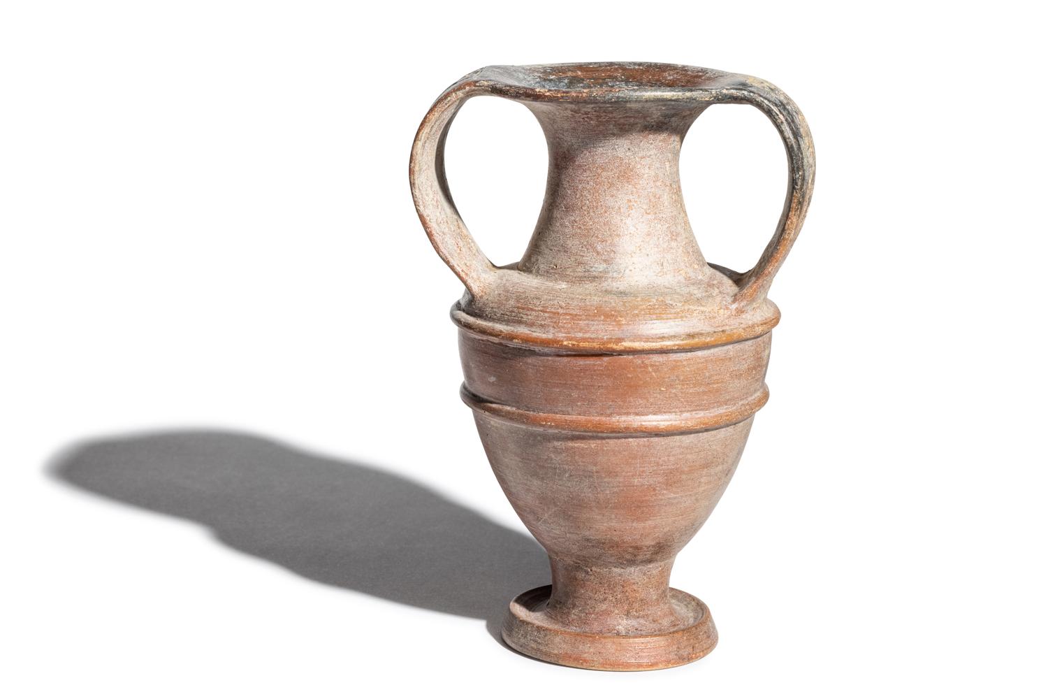 An Etruscan Painted Amphora with Animal Procession Handles