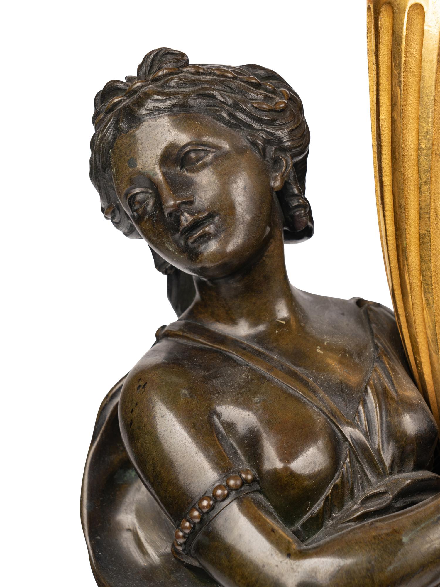 A Pair of Louis XVI Gilt and Patinated Bronze Four-Light Candelabra