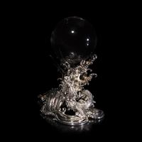 A Japanese Rock Crystal Sphere and Silver 'Dragon and Waves' Stand, Signed Yoshimasa Saku Meiji/Taisho Period 日本明治/大正時期 義正作潮を支配する珠と龍
