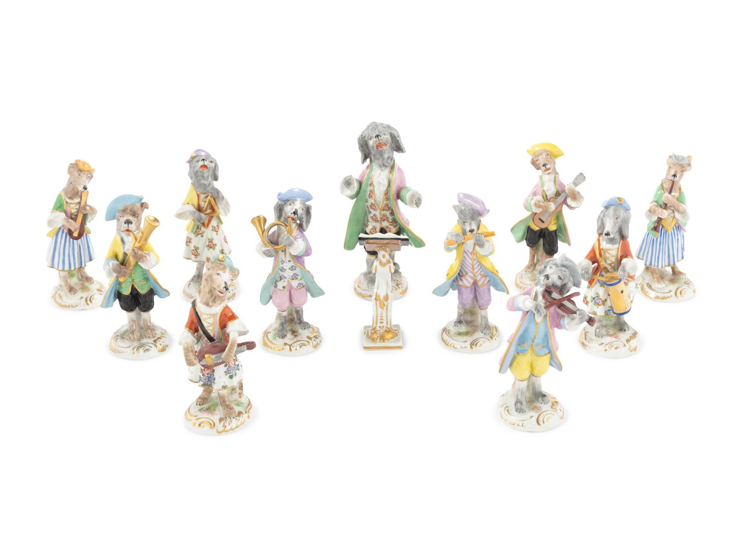 An Assembled Group of Twelve Continental Porcelain Dog Band Figures