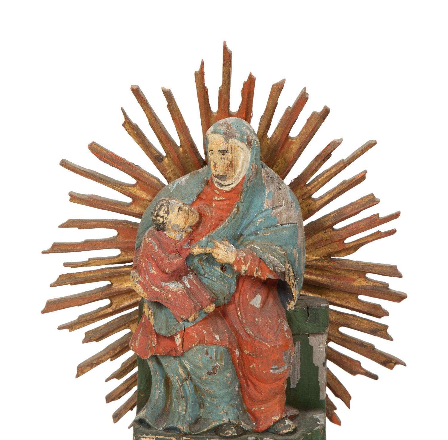 A Group of Eight Carved and Polychromed Santos Figures