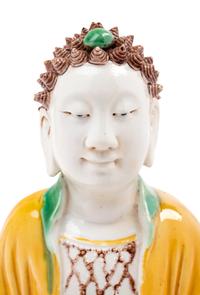 A Chinese Sancai Glazed Biscuit Figure of Buddha Shakyamuni