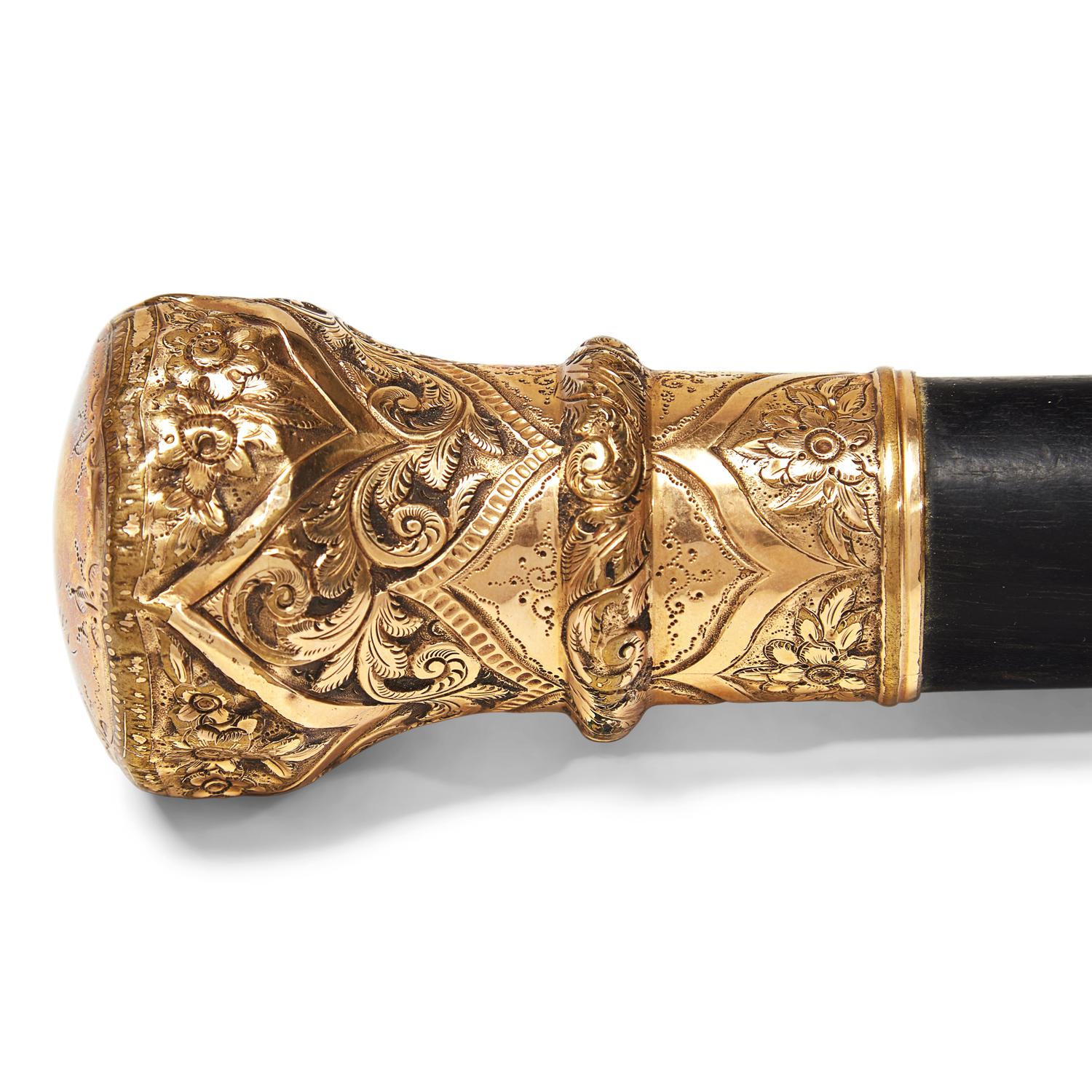 A Presentation Ebonized Wood Walking Stick with Gold-Plated Mount