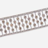 An 18K White Gold, Diamond, and Colored Diamond Bracelet