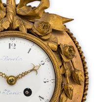 A Louis XVI Gilt Bronze Wall Clock