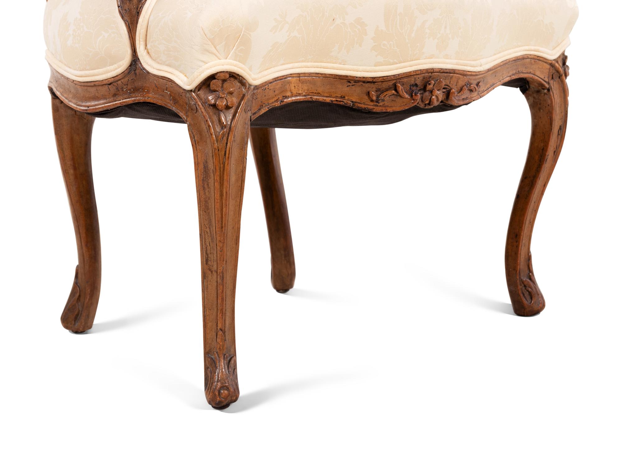 A Louis XV Walnut Fauteuil