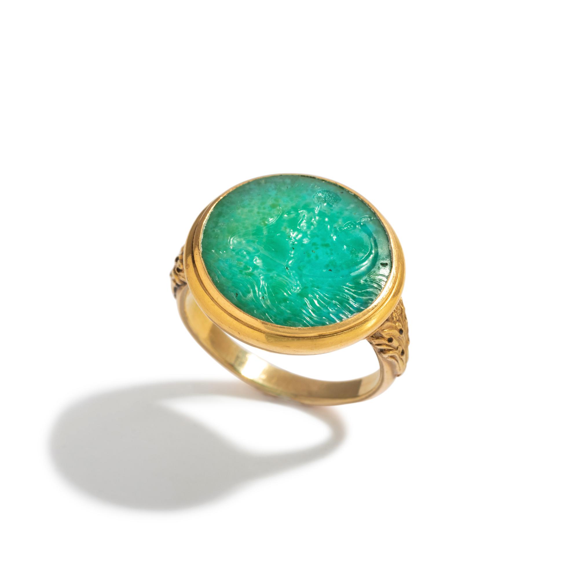 A Neoclassical Amazonite and Gold Finger Ring with the God Eros Riding a Dolphin and a Greek Inscription