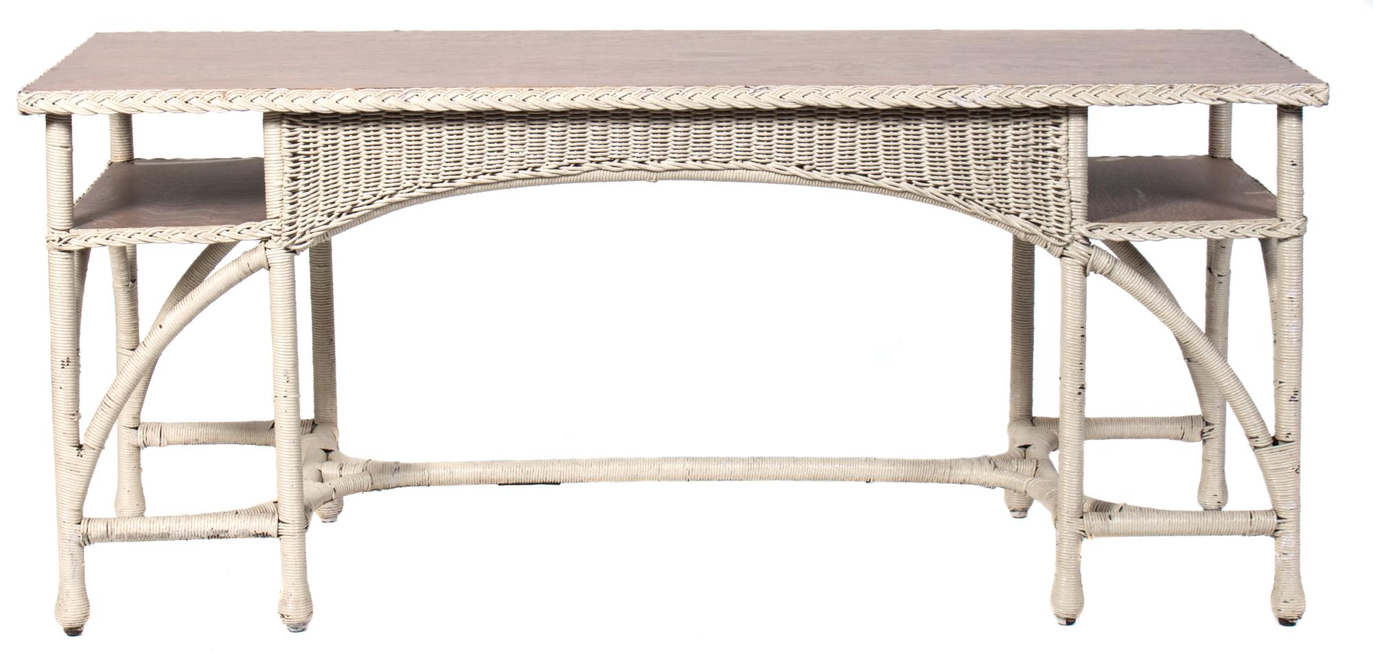 An American Wicker Console Table Height 29 1/2 x width 67 x depth 22 1/2 inches. — MID 20TH CENTURY
