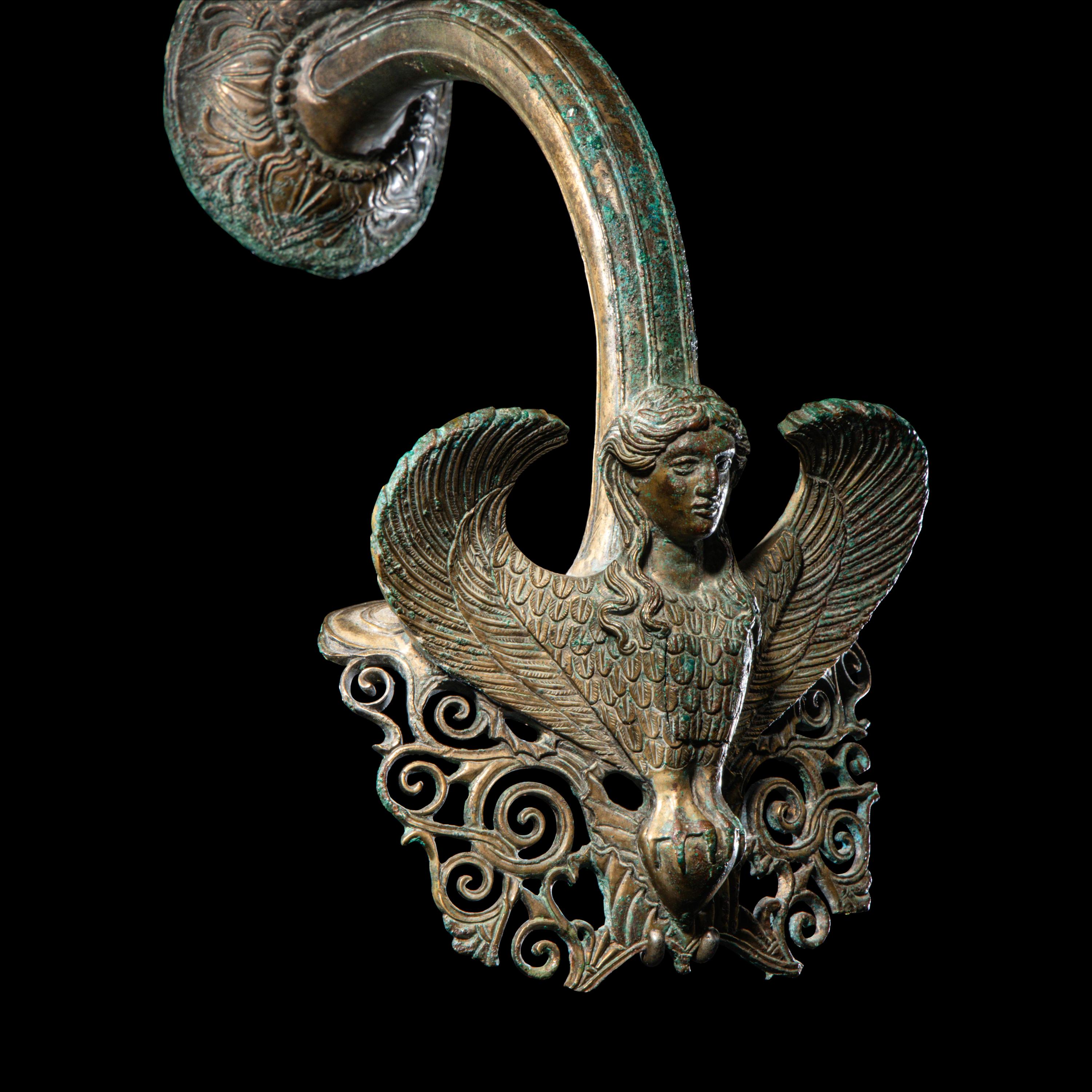 A Greek Bronze Hydria Handle with a Siren