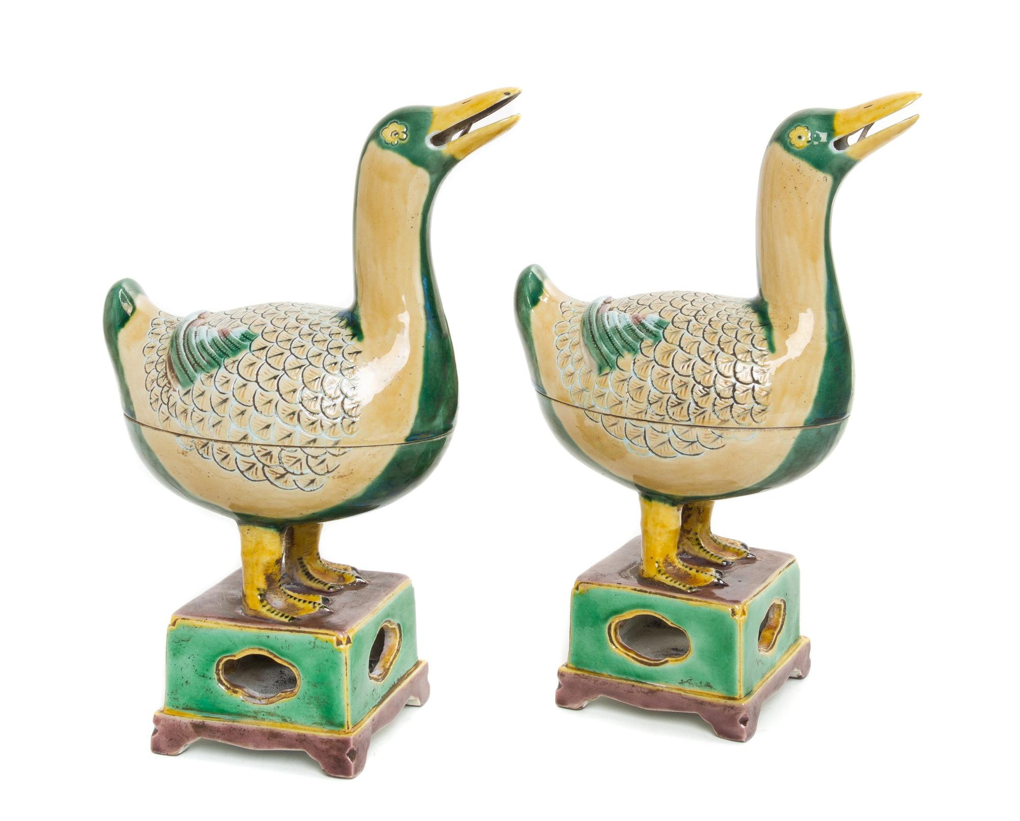 A Pair of Famille Verte Porcelain Duck-Form Covered Vessels Height of each 9 3/4 inches.