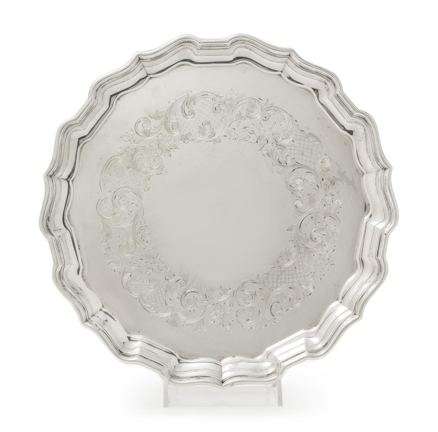 A Canadian Silver Salver, Henry Birks & Sons, Montreal, Quebec, 1939, having a scalloped rim and border, the field with engraved floral