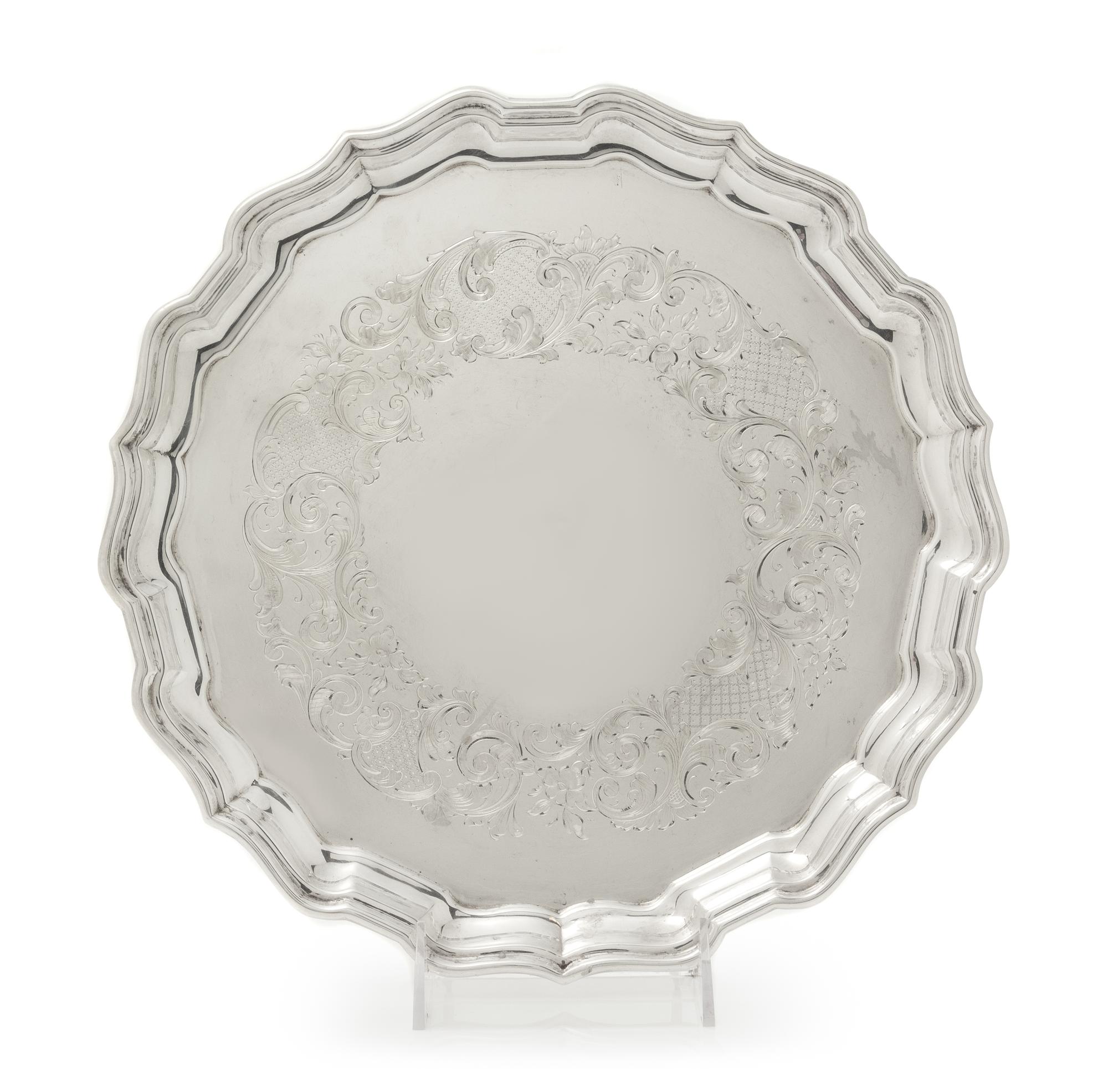 A Canadian Silver Salver, Henry Birks & Sons, Montreal, Quebec, 1939, having a scalloped rim and border, the field with engraved floral