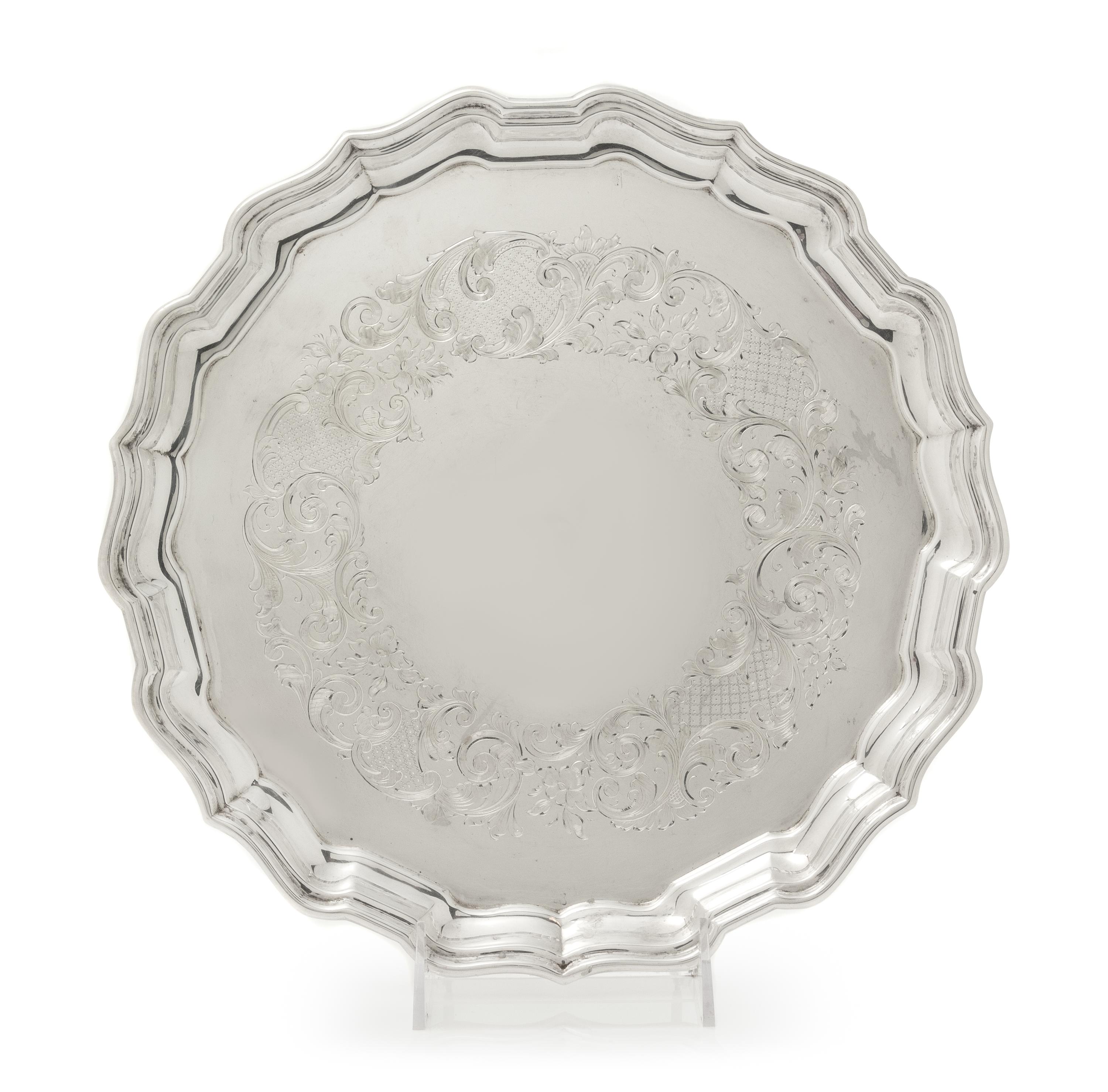 A Canadian Silver Salver, Henry Birks & Sons, Montreal, Quebec, 1939, having a scalloped rim and border, the field with engraved floral
