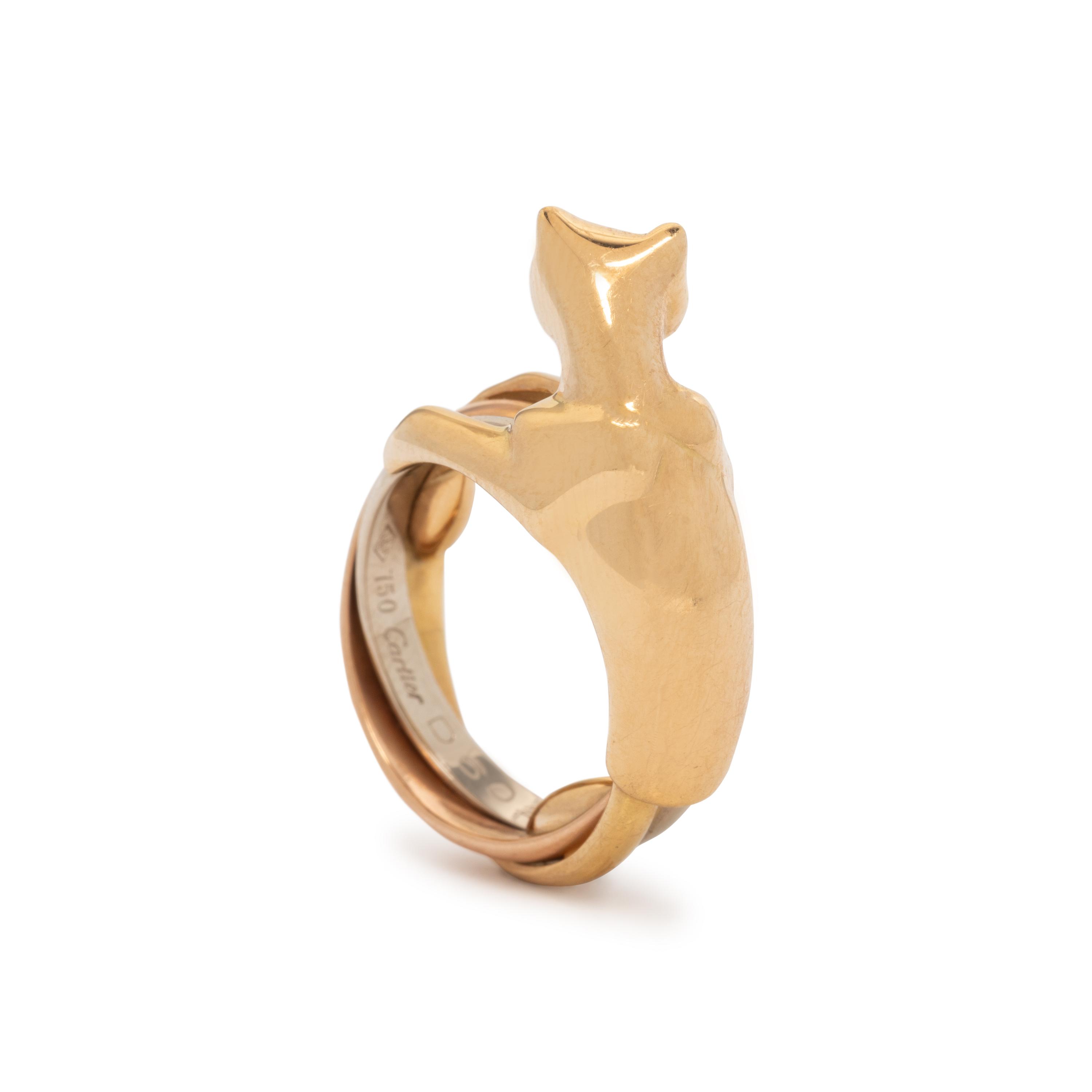 CARTIER, TRICOLOR GOLD, EMERALD AND ONYX 'PANTHÈRE' TRINITY RING