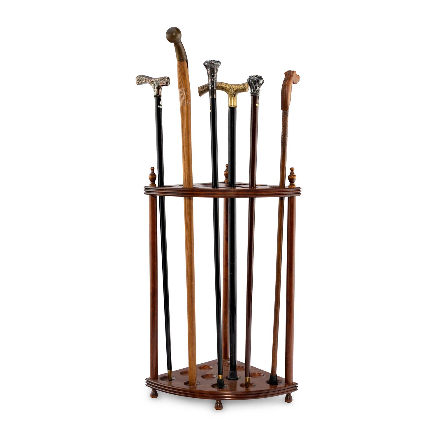 A Collection of Six Gentleman's Walking Sticks with Stand