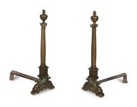A Pair of Large Patinated Metal Andirons