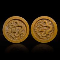 Two Chinese yellow glazed "Dragon" roof tile ends 黃釉龍紋瓦當兩片 Probably Ming dynasty
