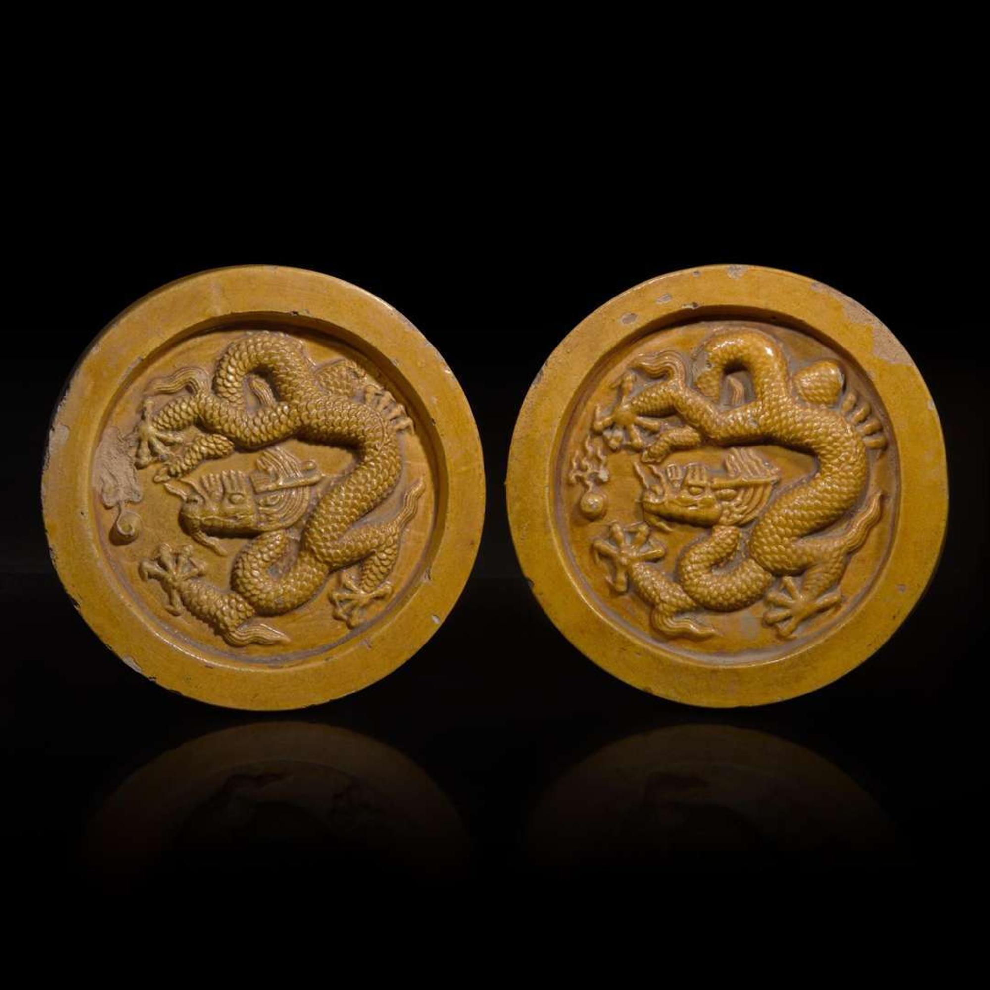 Two Chinese yellow glazed "Dragon" roof tile ends 黃釉龍紋瓦當兩片 Probably Ming dynasty