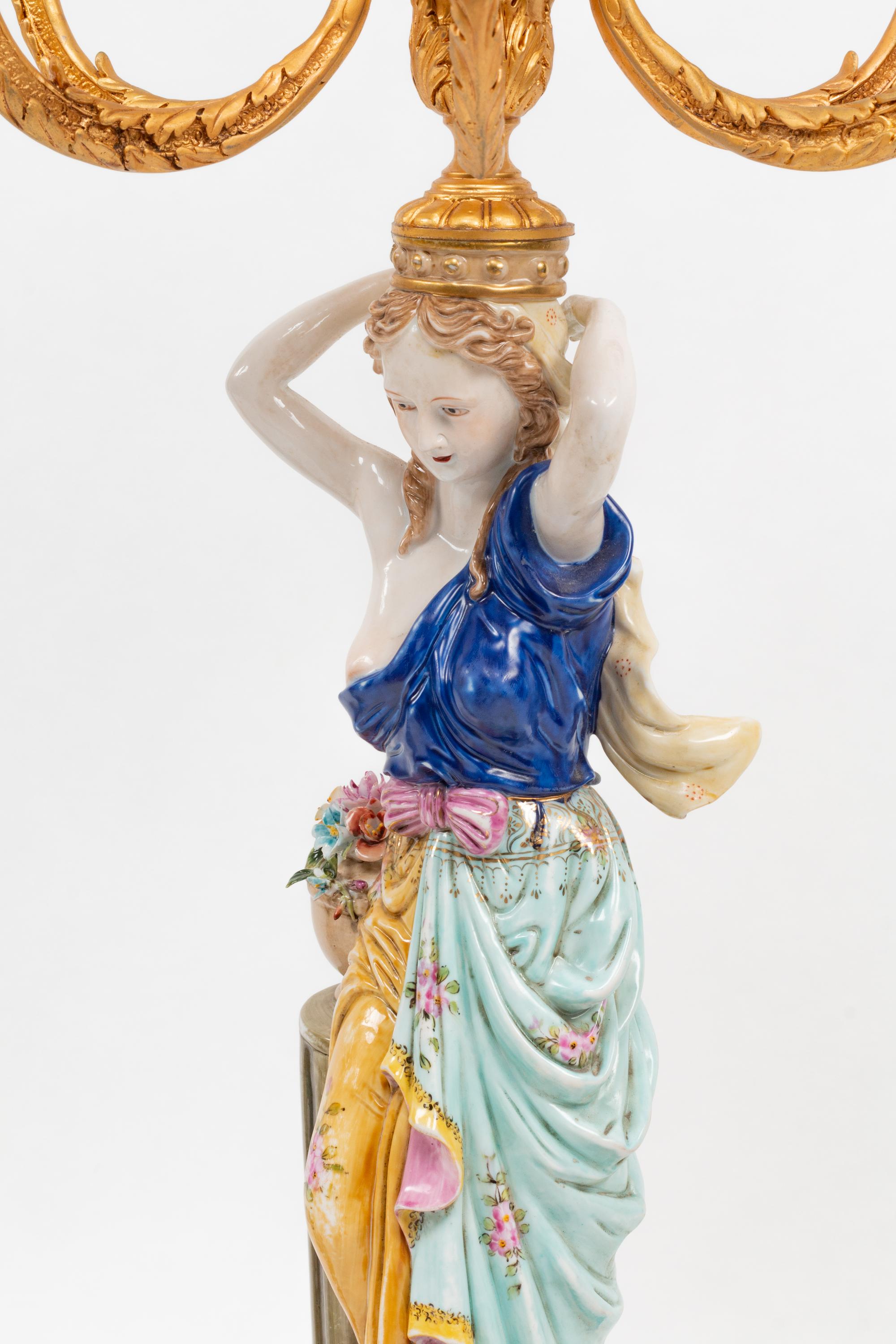 A Pair of German Porcelain and Gilt Bronze Figural Seven-Light Candelabra