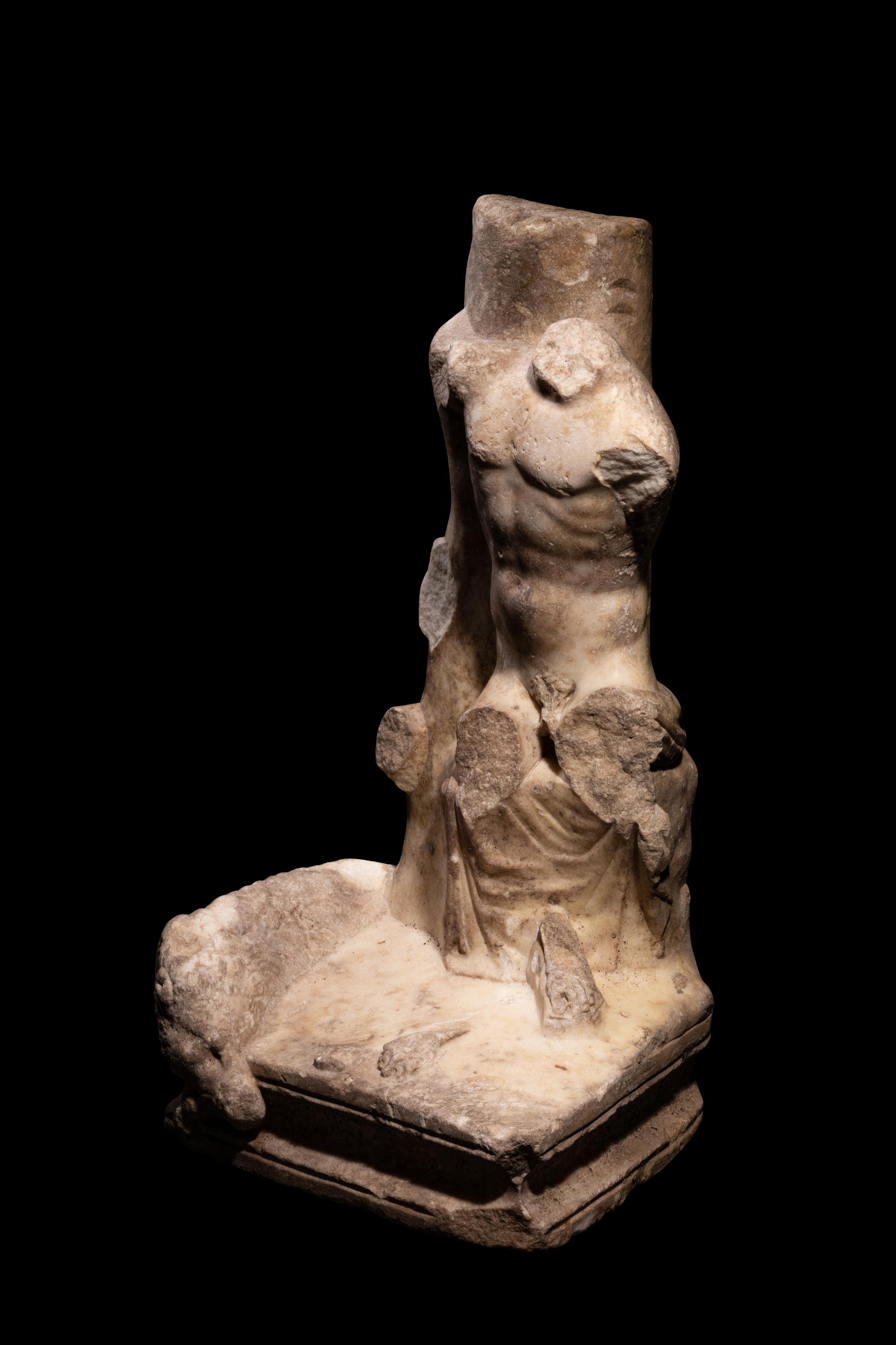 A Roman Marble Sculpture Support with a Male Torso