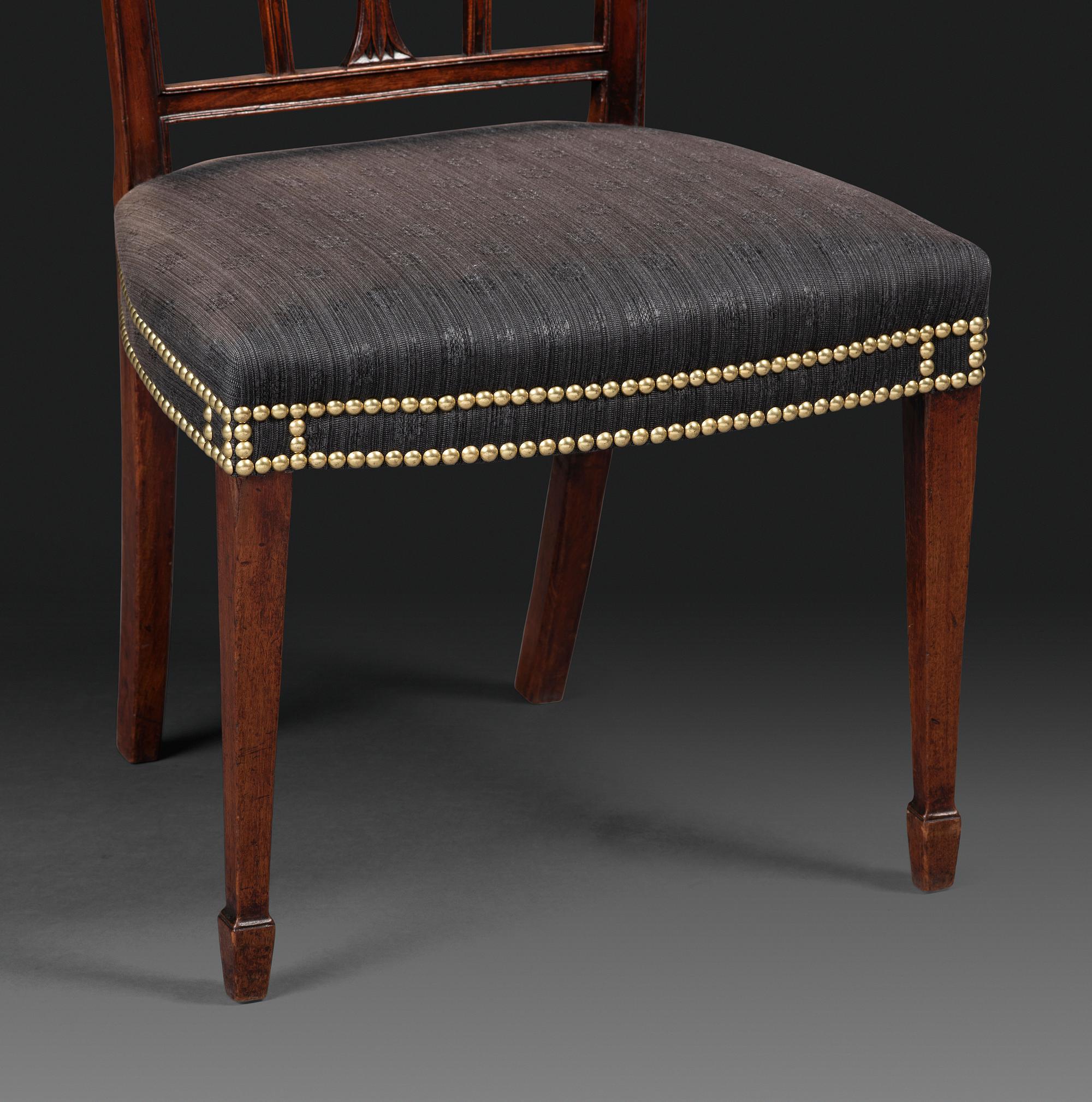 A Set of Eight Federal Carved Mahogany Dining Chairs