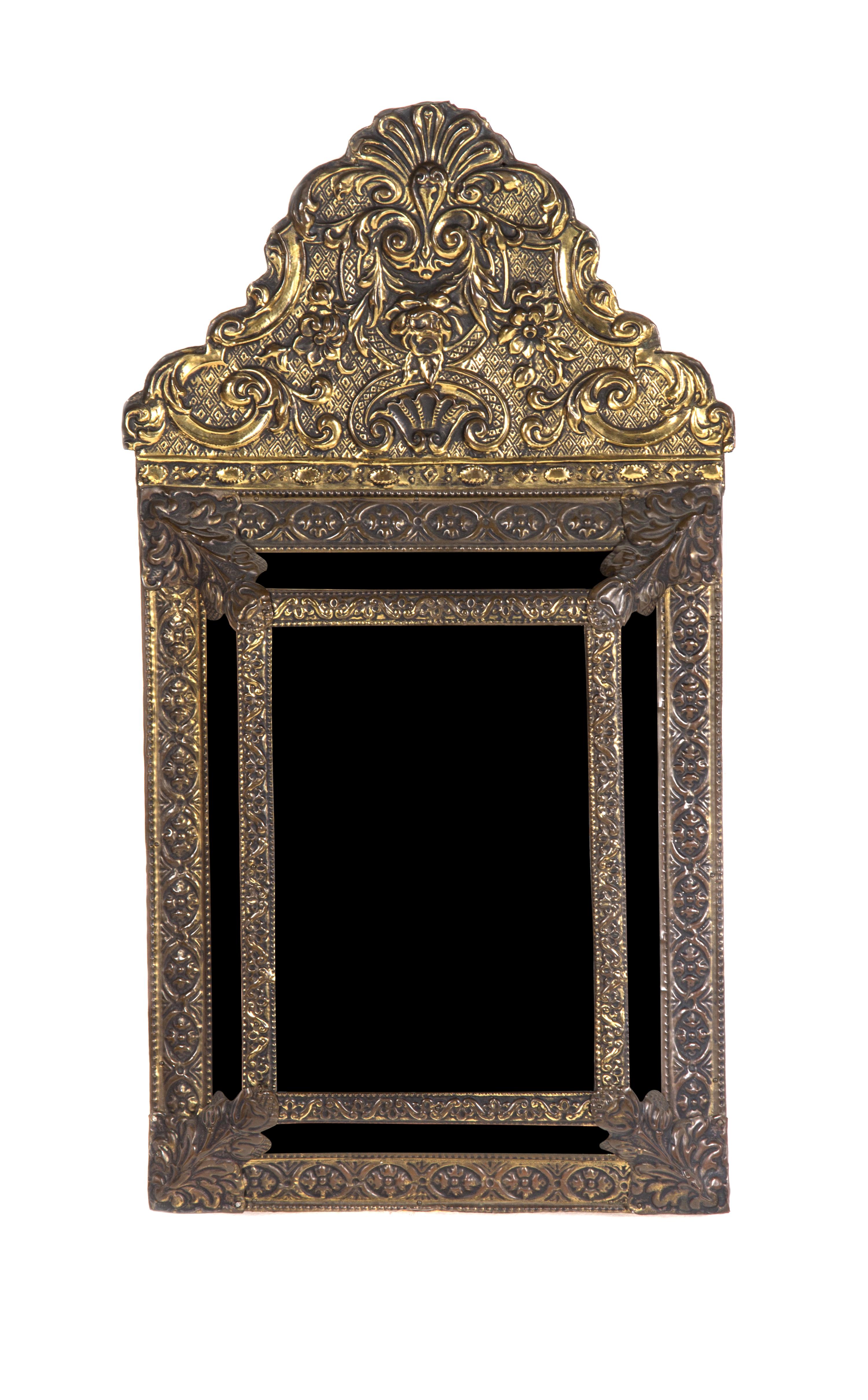 A Dutch Brass Wall Mirror, Height 24 x width 12 3/4 inches.