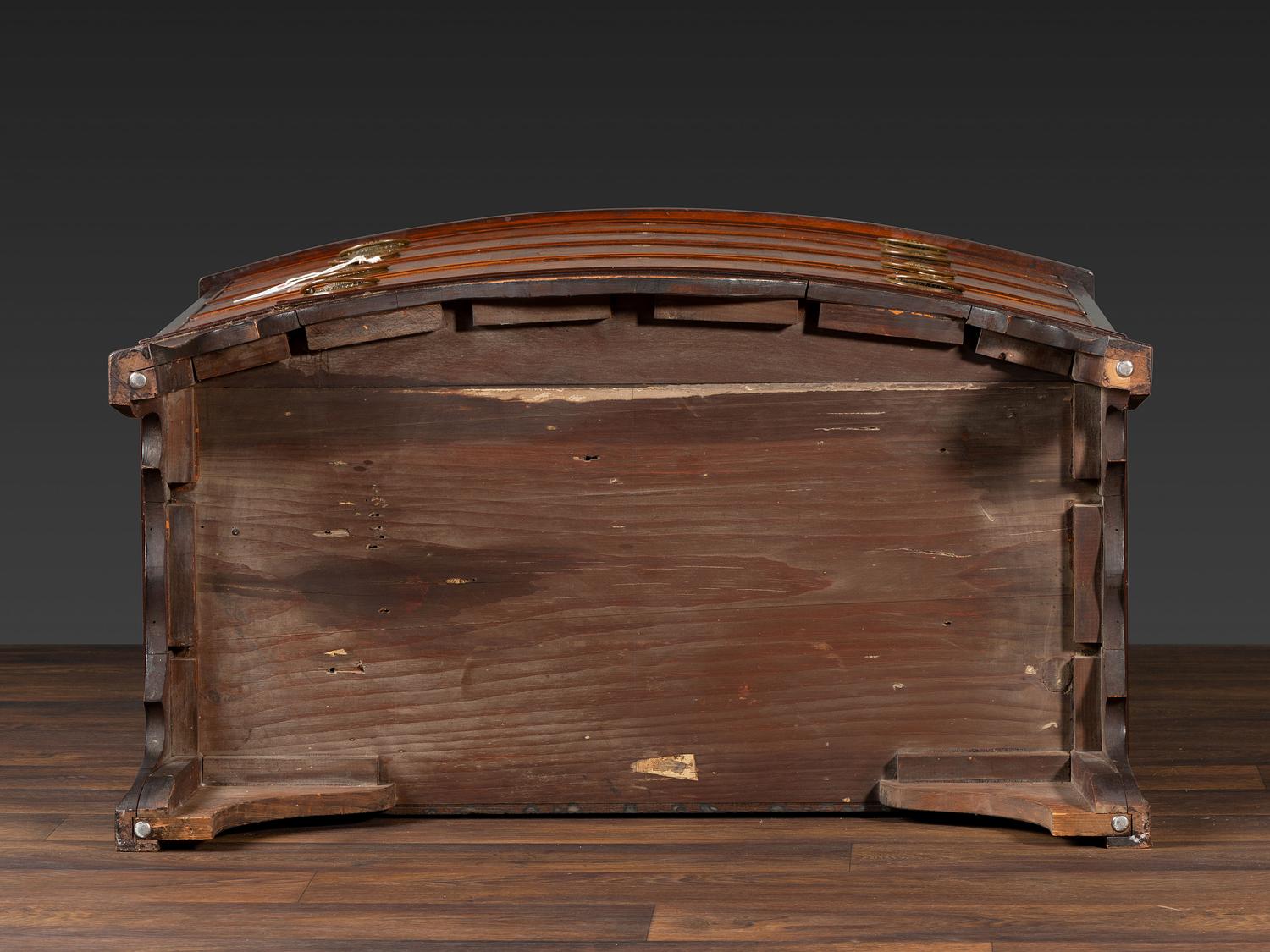 A Federal Inlaid and Figured Mahogany Bow-Front Chest of Drawers