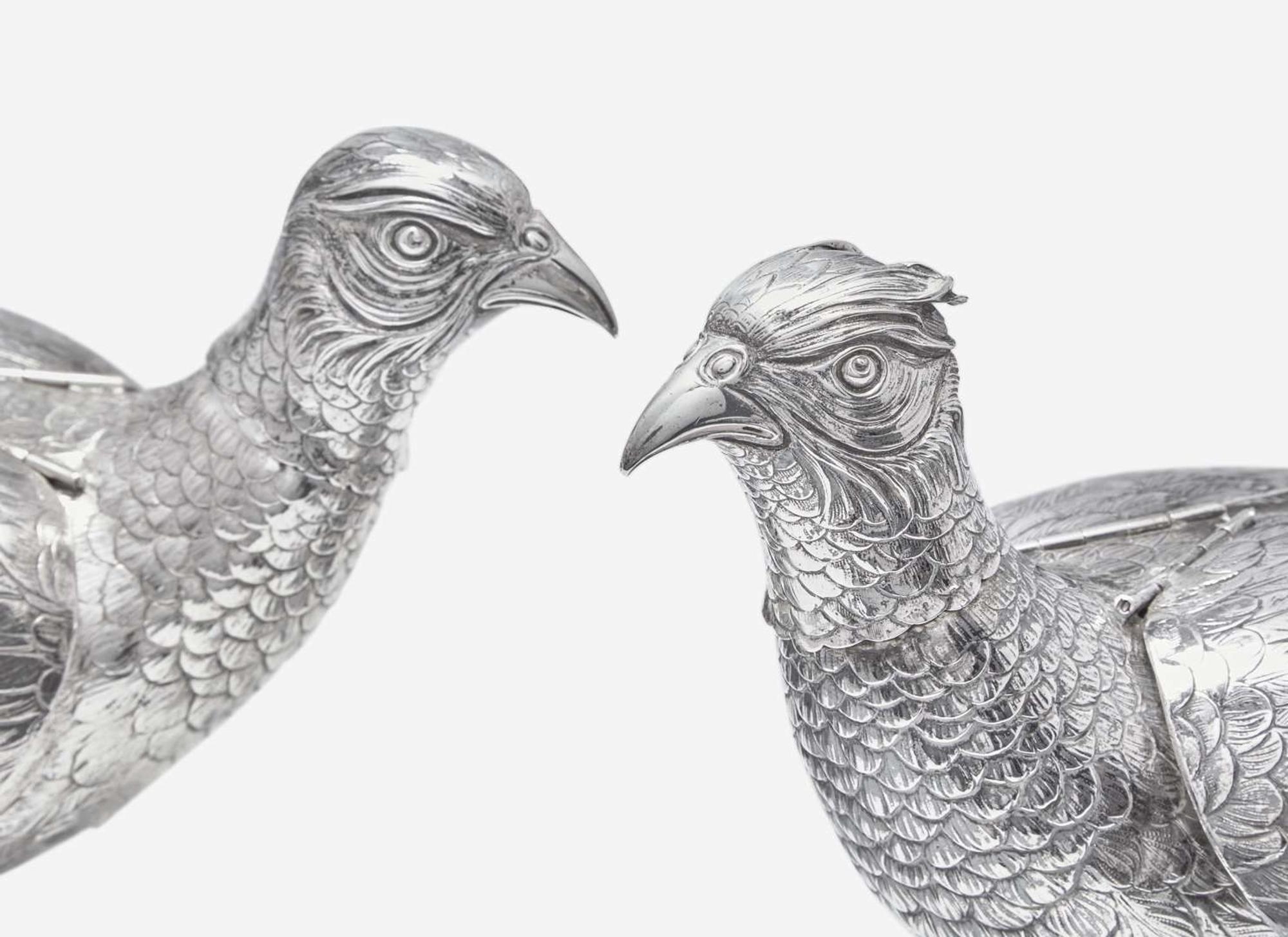 A pair of .800 silver pheasant-form decanters, Vereinigte Silberwarenfabrik, Hanau, Germany, early 20th century