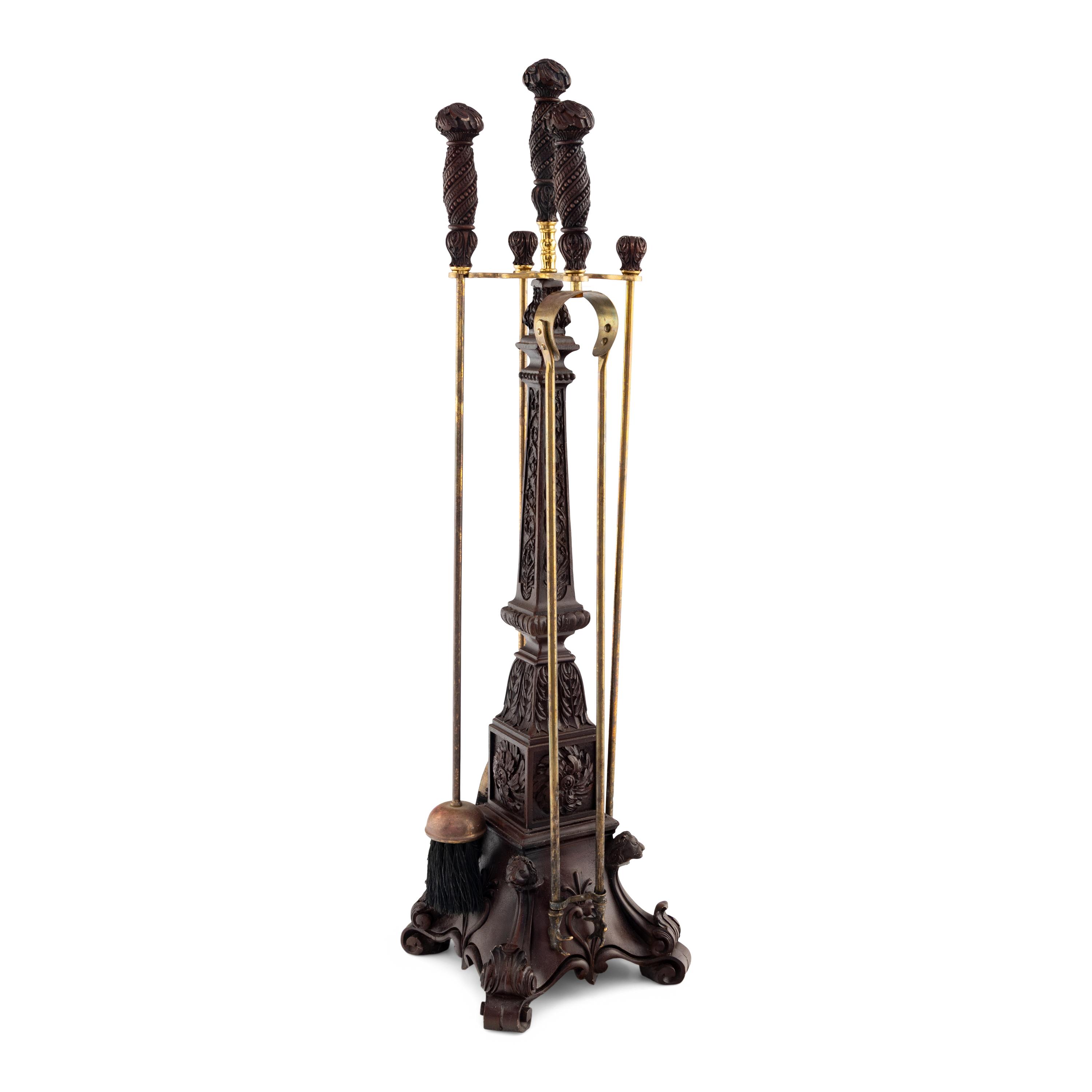 A Set of Swiss "Black Forest" Carved Fireplace Tools