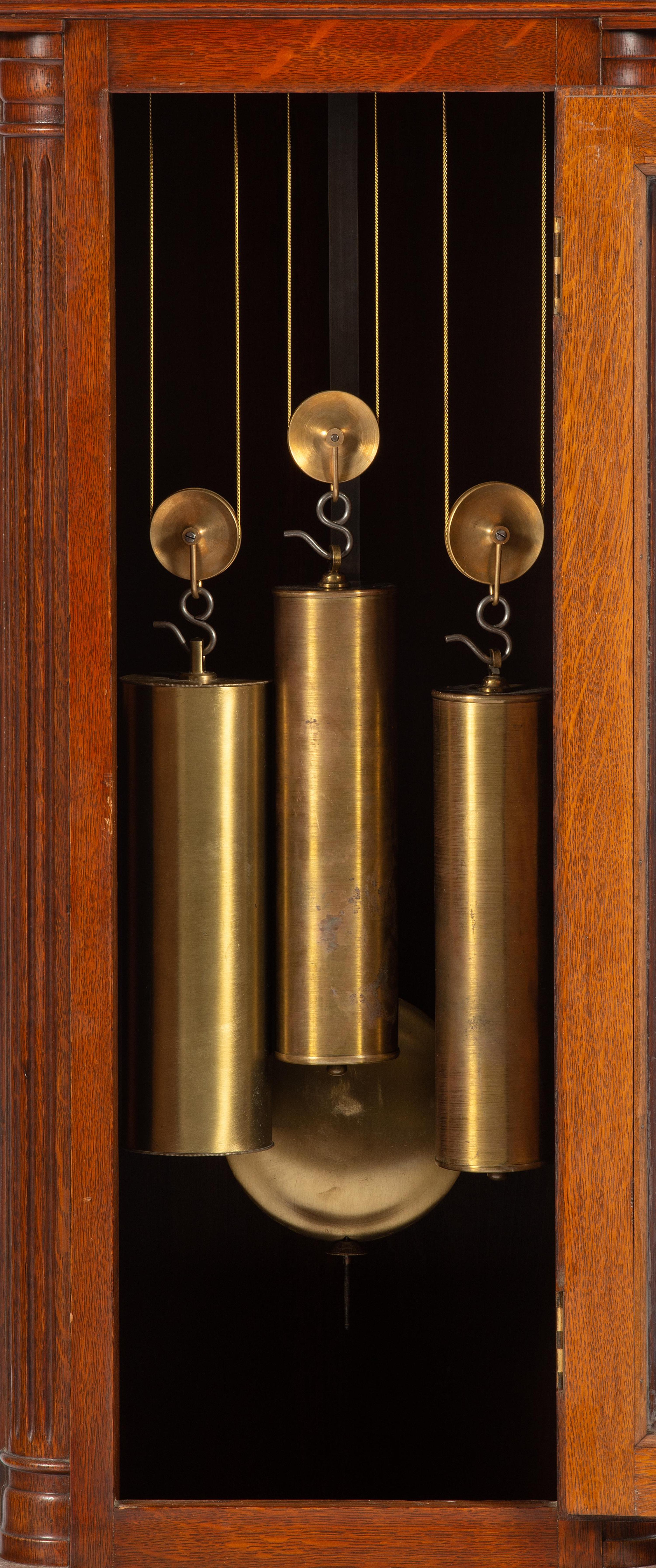 A Winterhalder and Hofmeier Oak Tall Case Clock