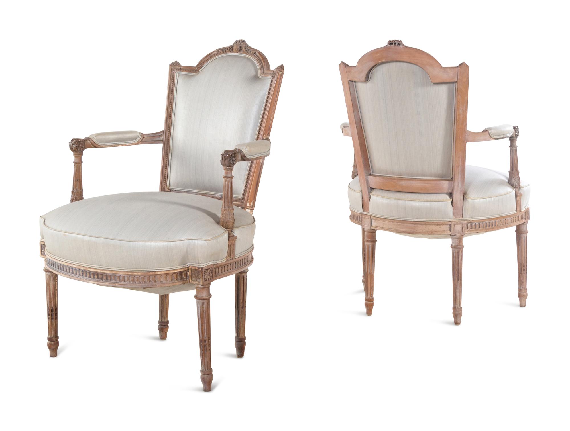 A Pair of Louis XVI Limed Beech Fauteuils