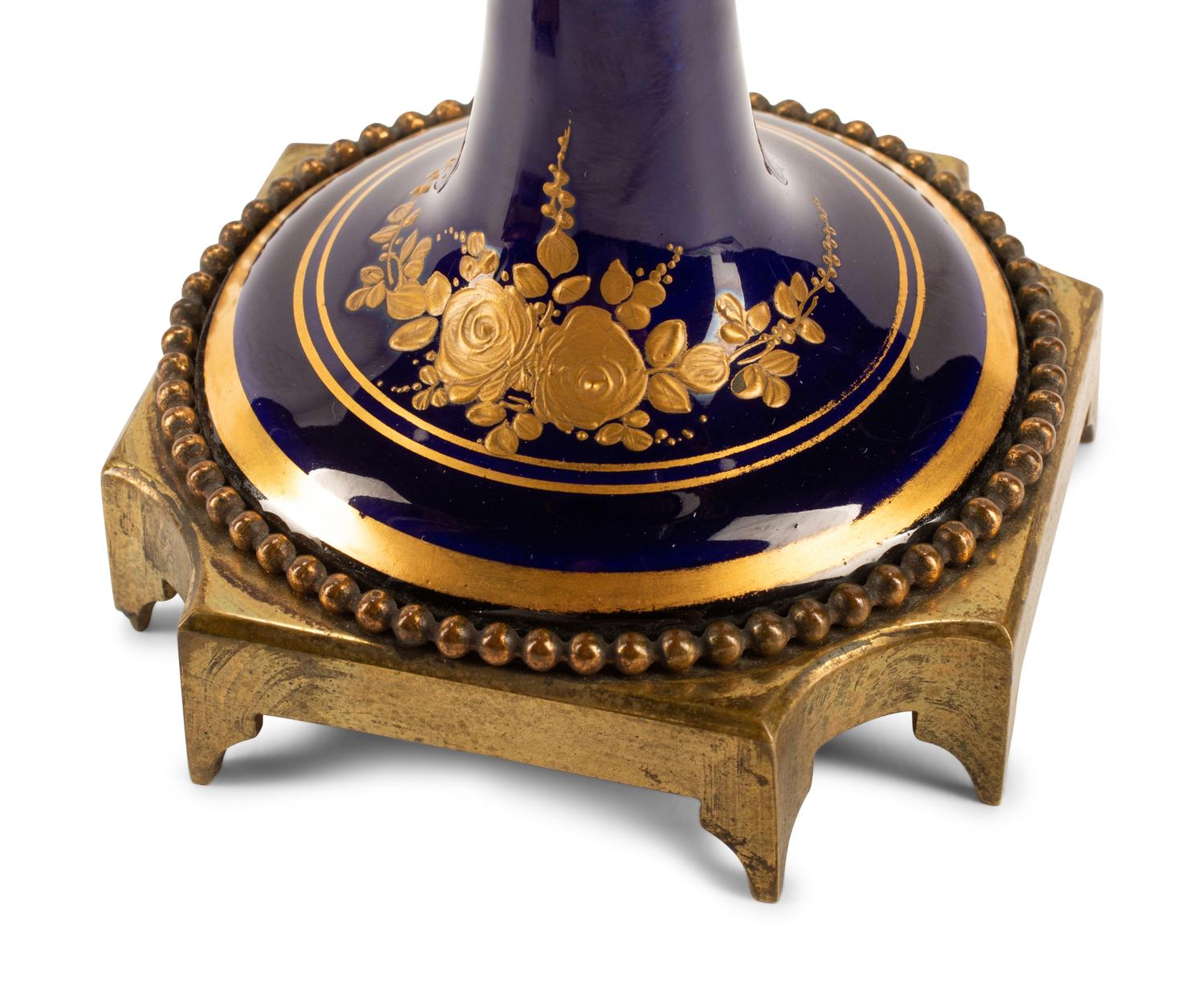 A Pair of Gilt Bronze Mounted Sèvres Style Porcelain Urns