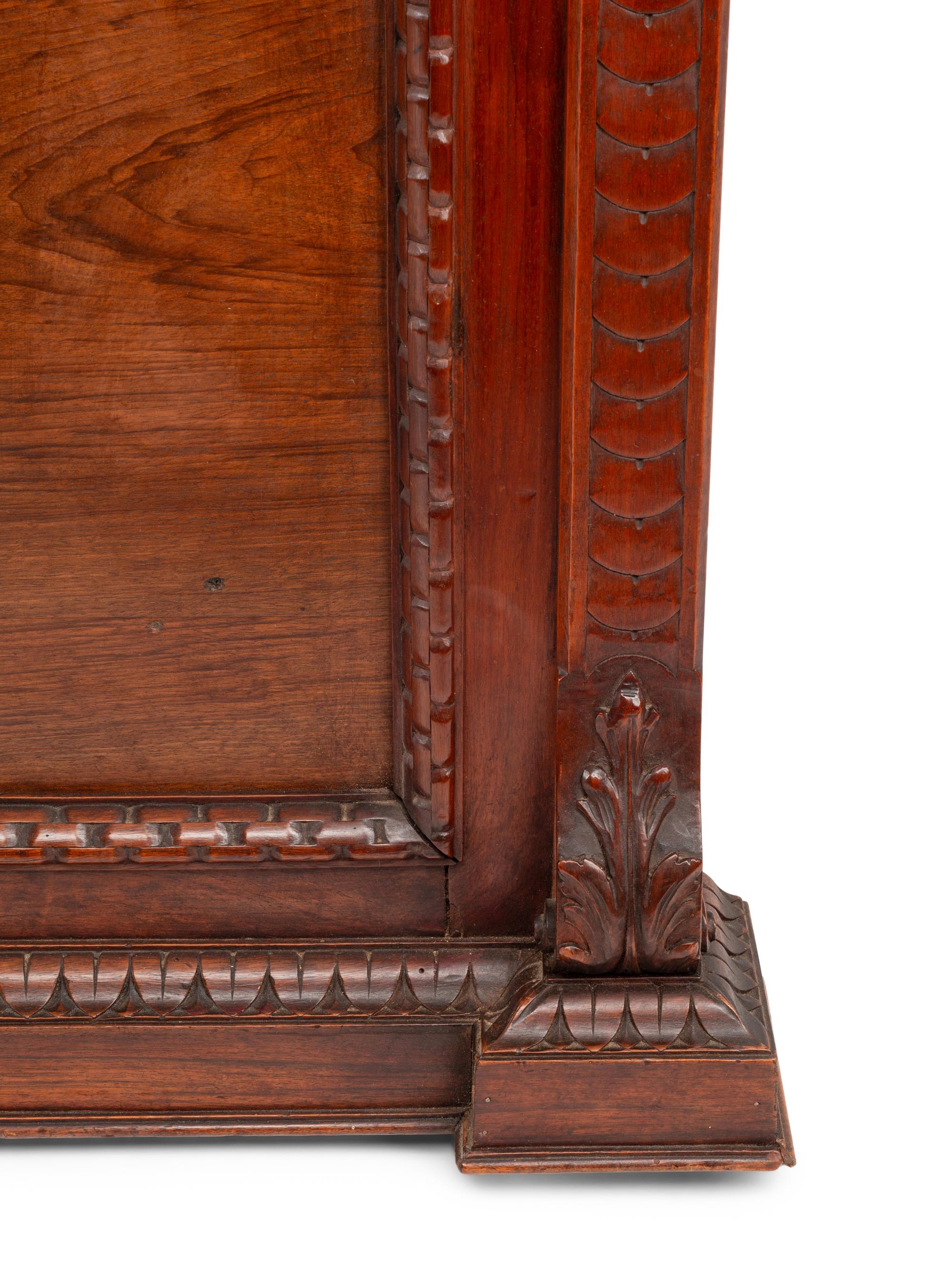 A Pair of Italian Carved Walnut Panels with Marble Profile Plaques