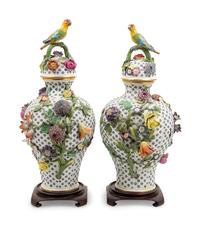 A Pair of Continental Porcelain Covered Urns