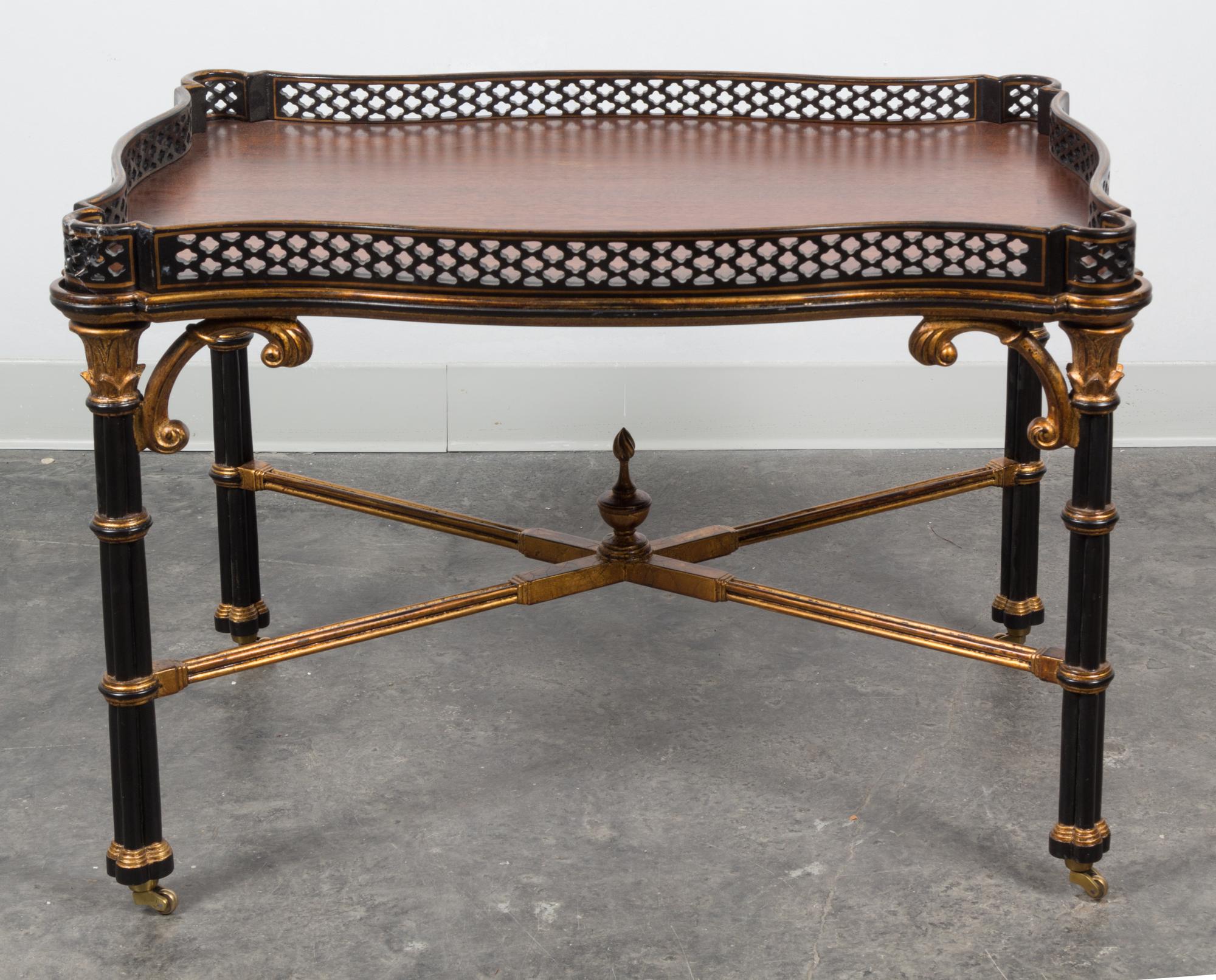 A Chippendale Style Parcel Gilt and Ebonized Low Table Height 21 5/8 x width 32 1/4 x depth 22 1/4 inches. — 20TH CENTURY