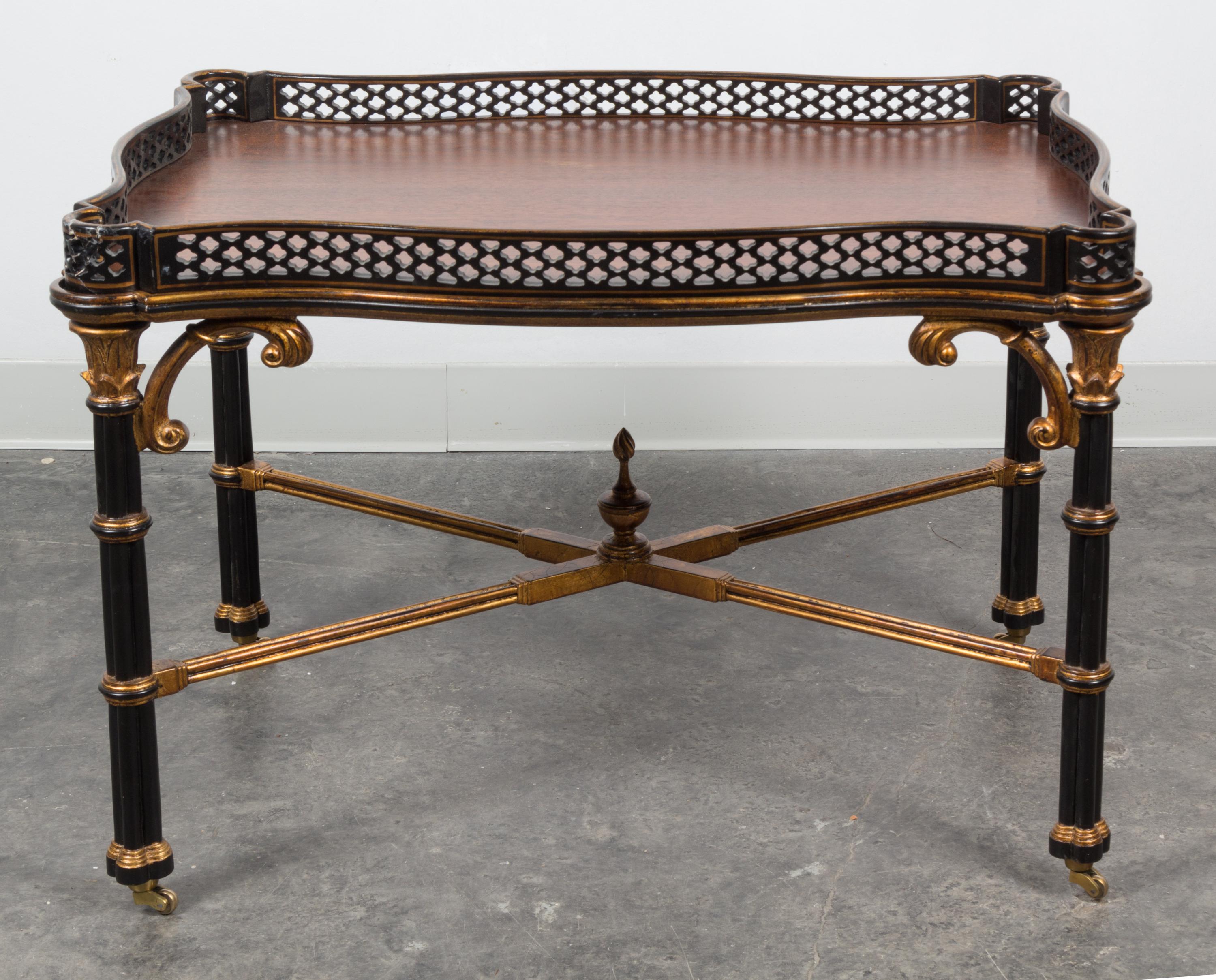A Chippendale Style Parcel Gilt and Ebonized Low Table Height 21 5/8 x width 32 1/4 x depth 22 1/4 inches. — 20TH CENTURY