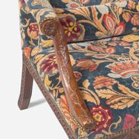 A George III carved walnut library armchair circa 1765