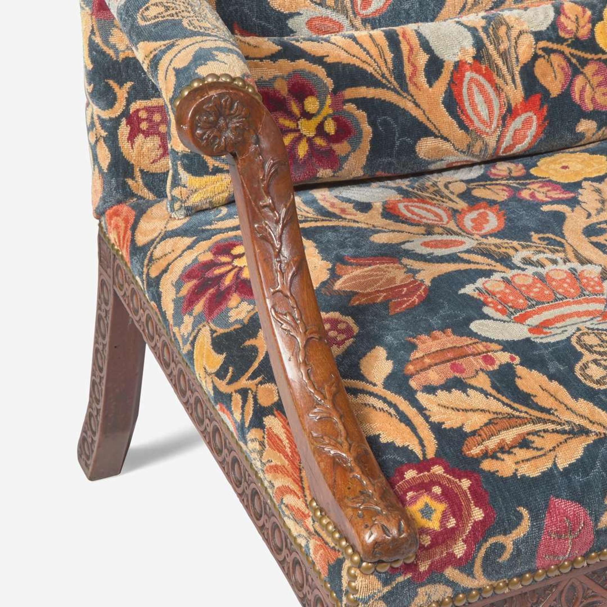 A George III carved walnut library armchair circa 1765