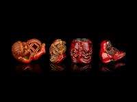 Four Japanese Carved and Red Lacquered Wood Netsuke